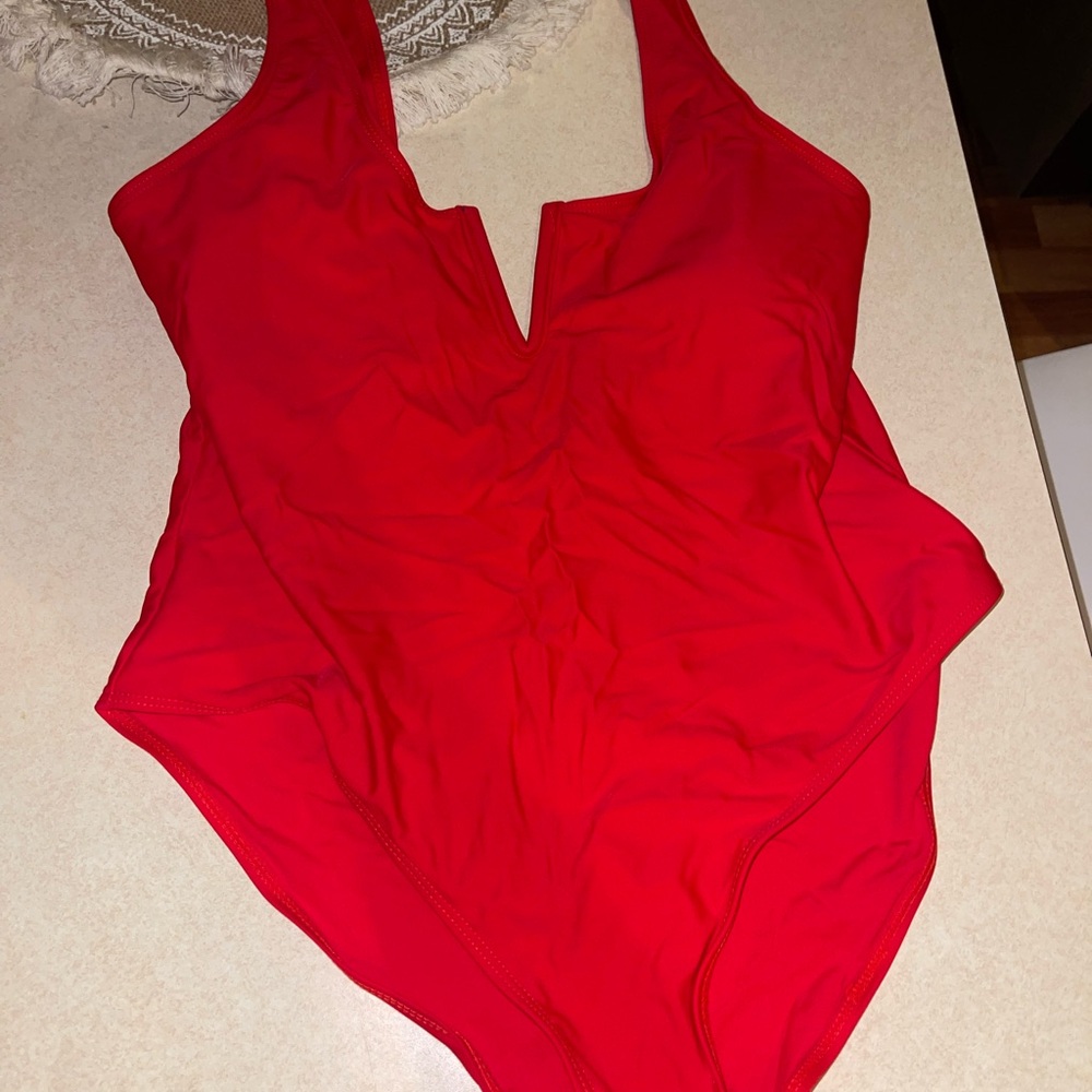 Vibrant Red One-Piece Swimsuit with Halter Neck and Plunging V-Neckline